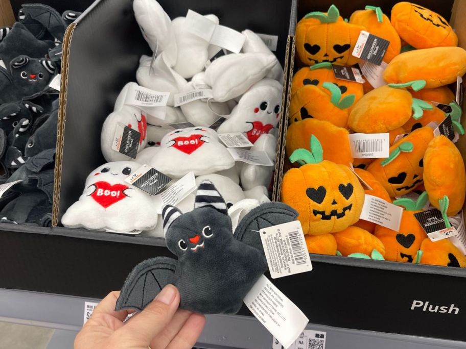Hand holding a Way to Celebrate Bat Halloween Plush