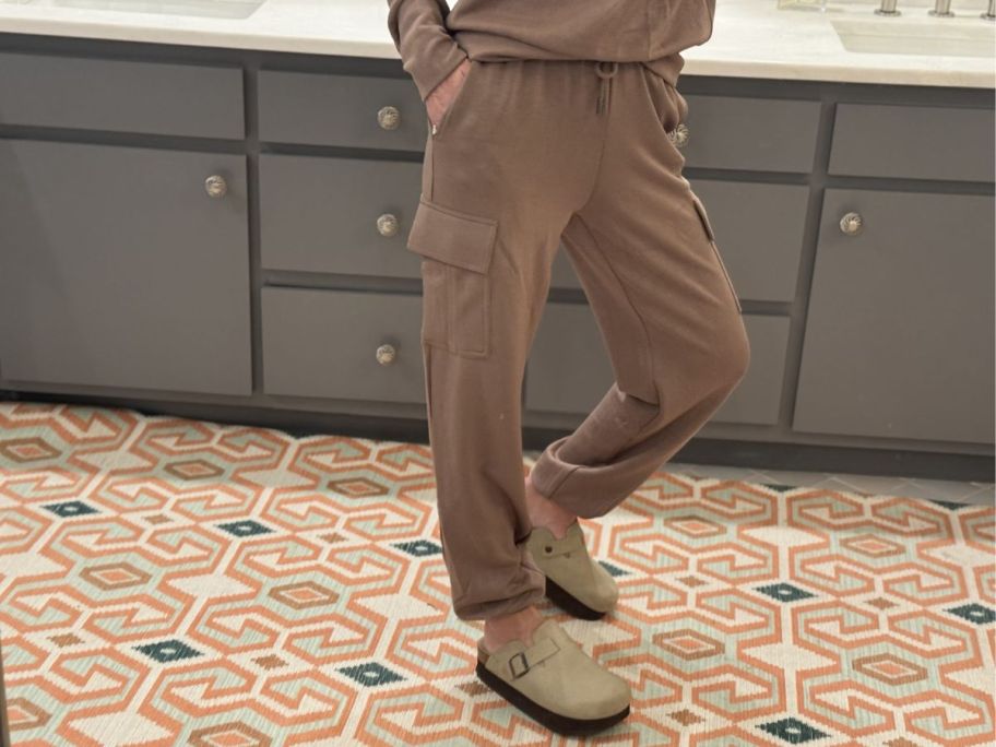 Woman wearing brown Scoop ScubaKnit joggers