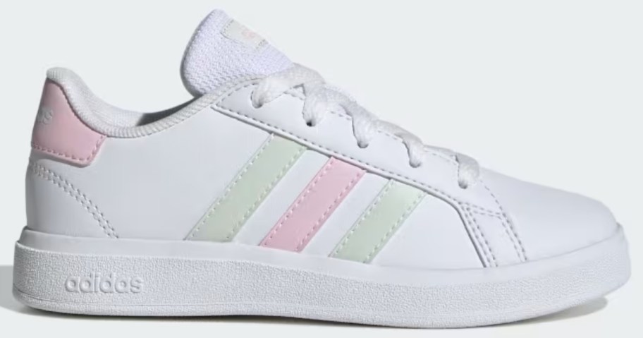 kid's adidas court style shoe in white with light pink and green accents