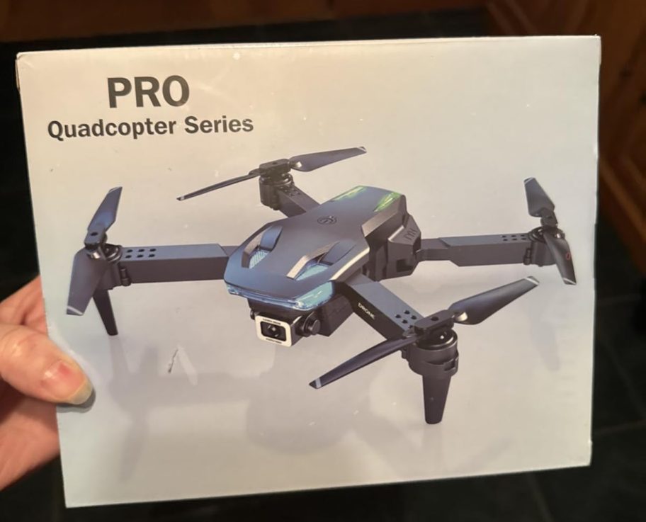 hand holding drone box