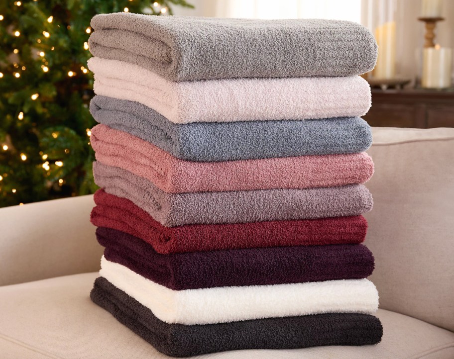 multi colored blankets in a stack