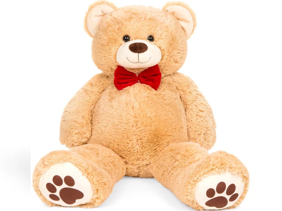 large teddy bear plush with red bow tie