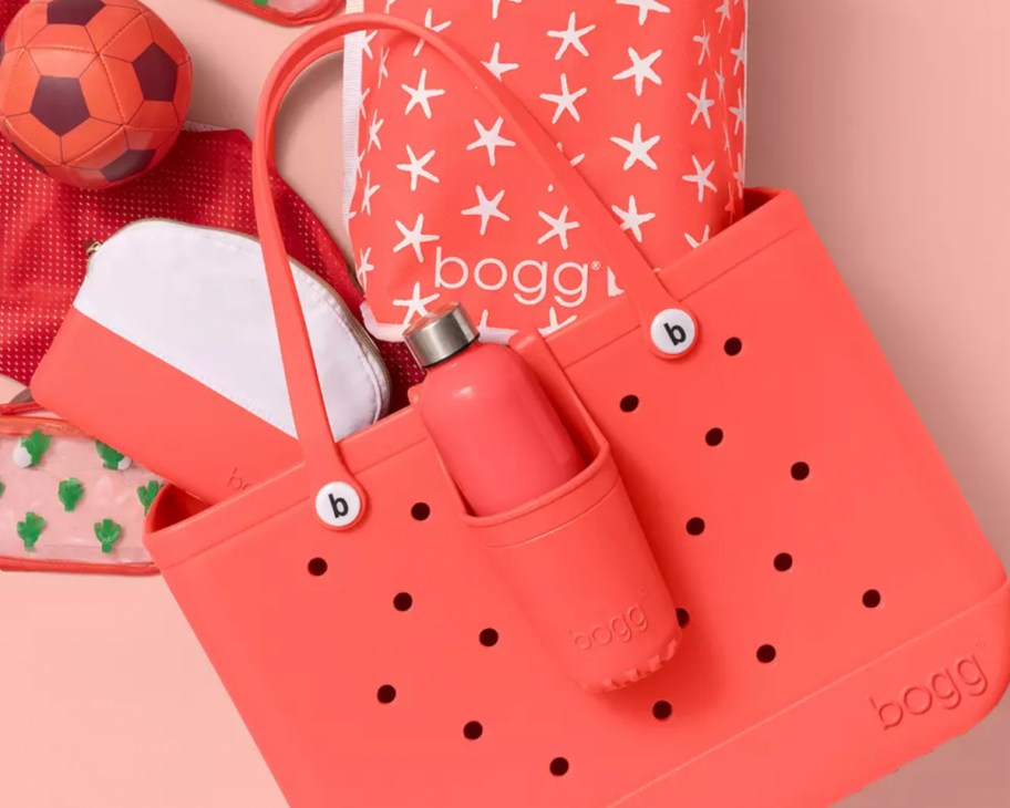 red bogg bag with items spilling out