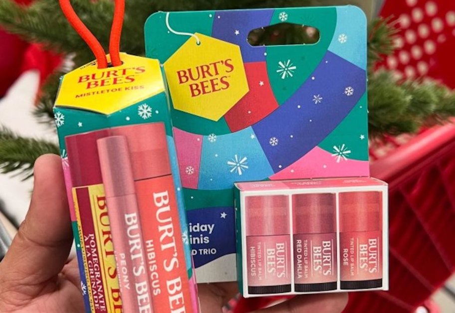 hand holding burts bees holiday lip balms