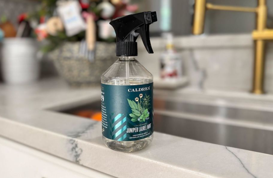 caldrea countertop spray on edge of white sink