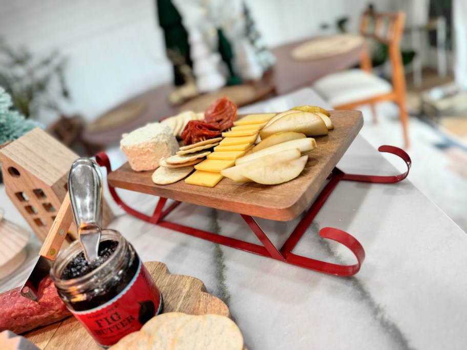 charcuterie board with meat and cheese eon a sleigh