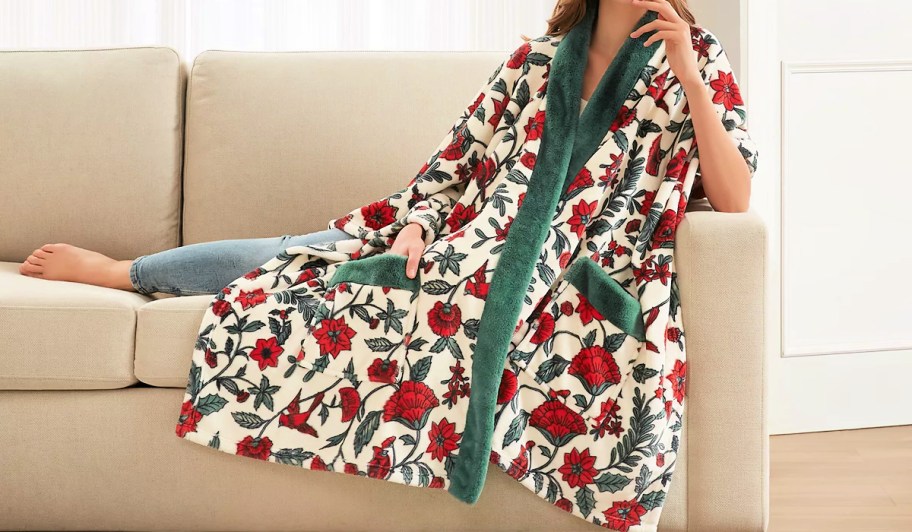 woman laying on a couch in a floral print wrap