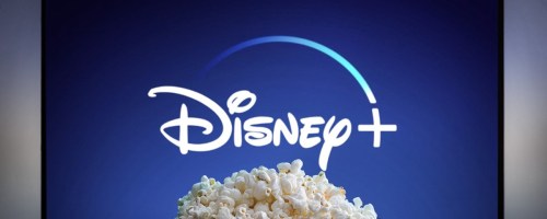 disney plus on tv with bowl of popcorn in front of it