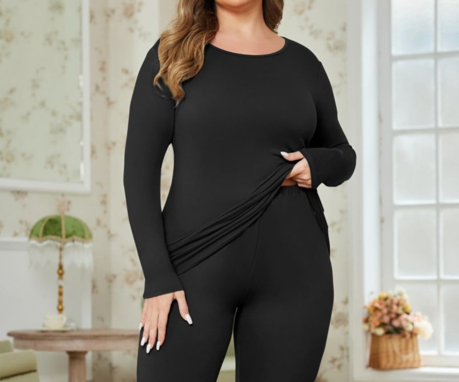 woman in black plus size thermal set