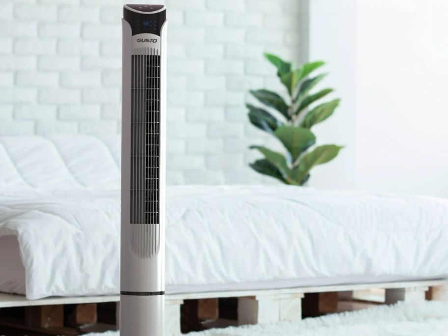 gusto tower fan in front of bed