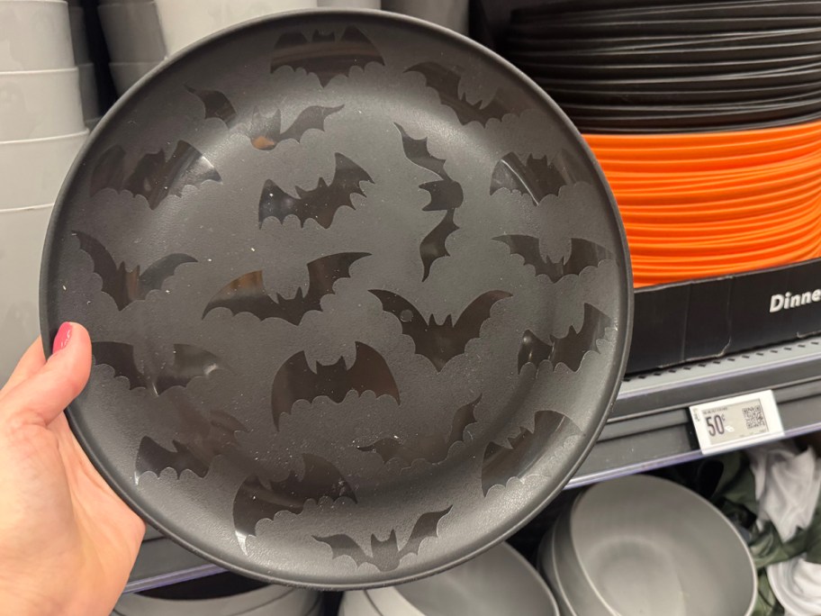 hand holding halloween plate