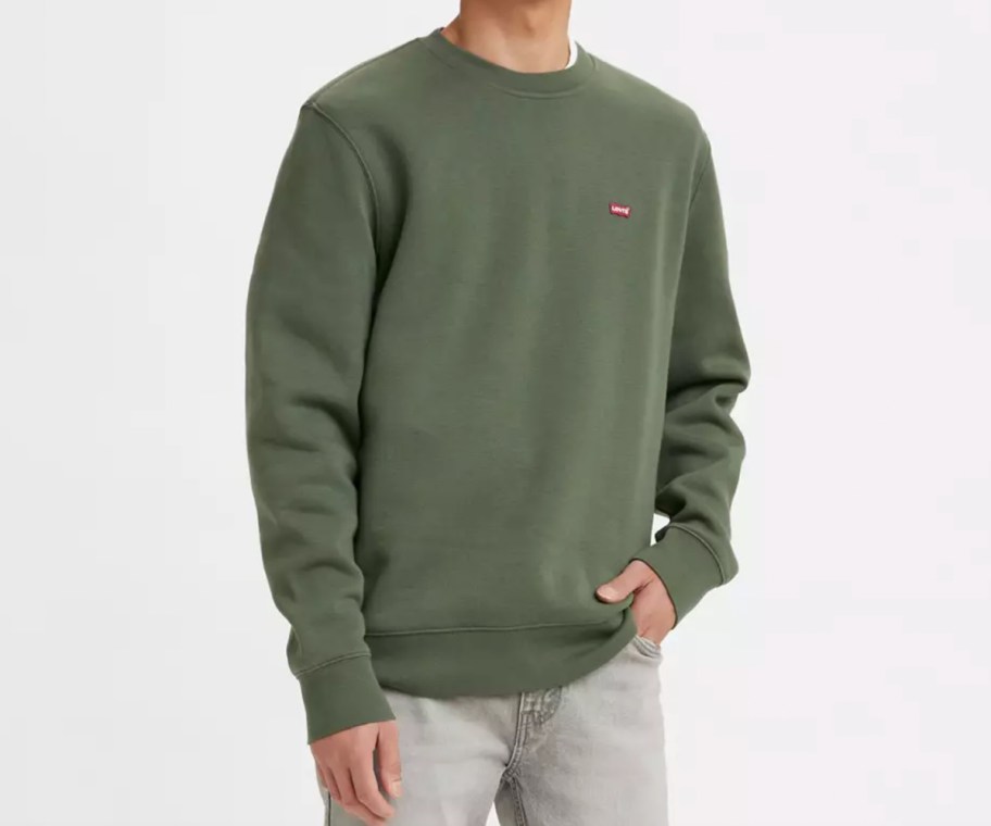 man in green crewneck sweatshirt