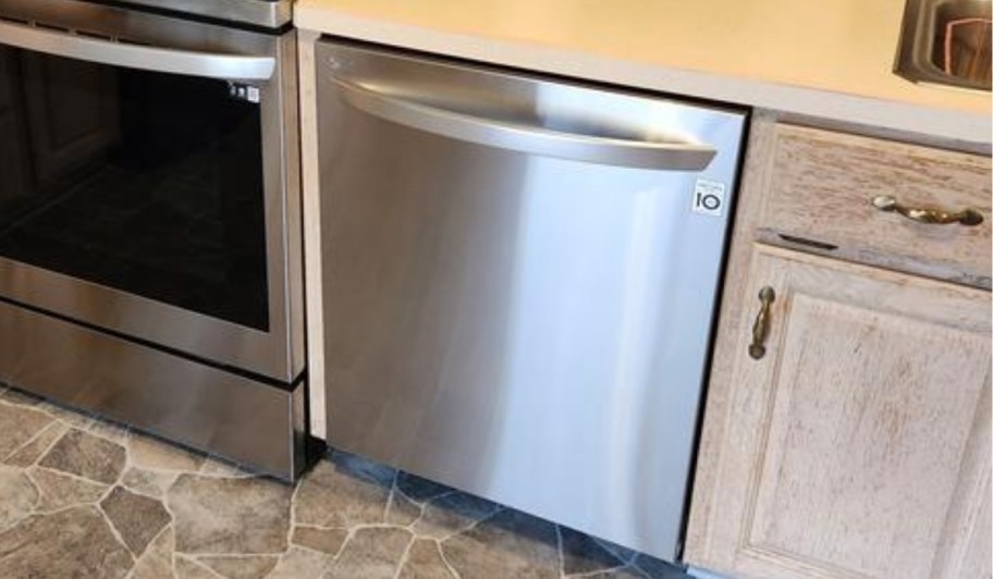 lg 24 inch stainless steel dishwasher installed in a kitchen