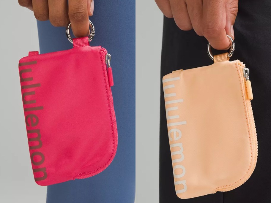 hands holding a pink and a peach lululemon Clippable Card Pouch 