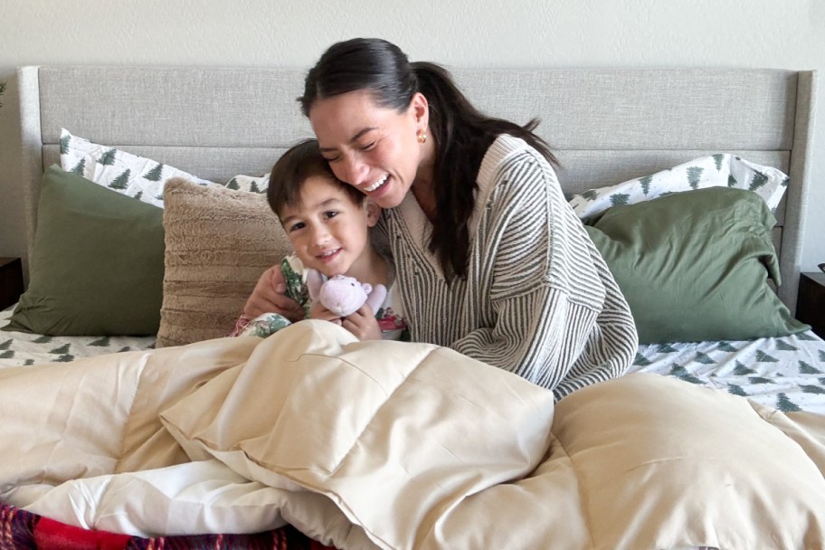 mom and child snuggling on bed