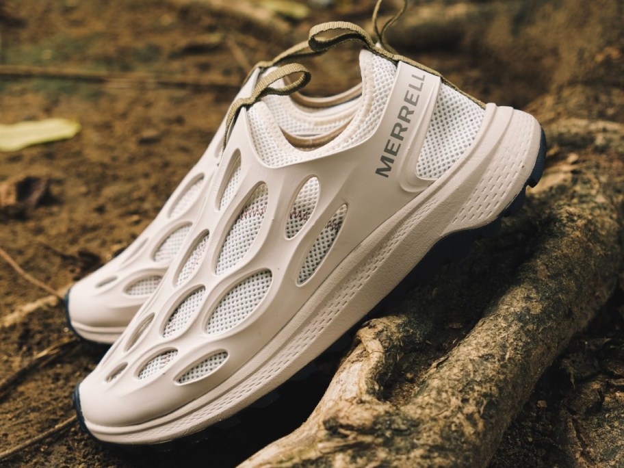 white water running shoes on log