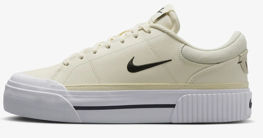 women's court lift shoes in cream and white with black accents