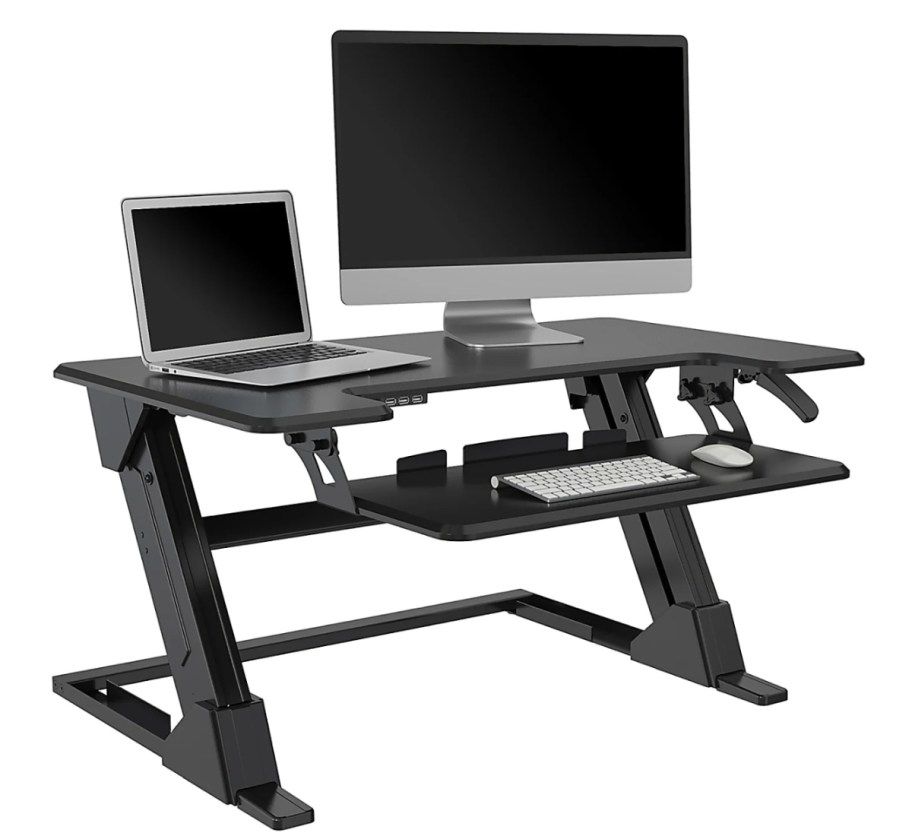 standing desk with two monitors on it