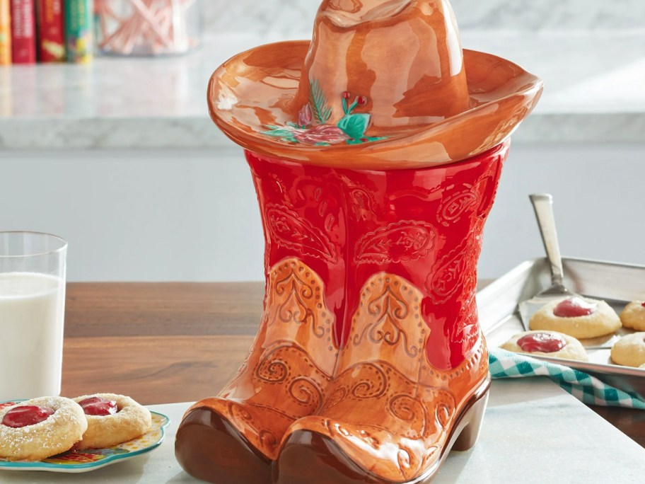 red boots and hat cookie jar on table