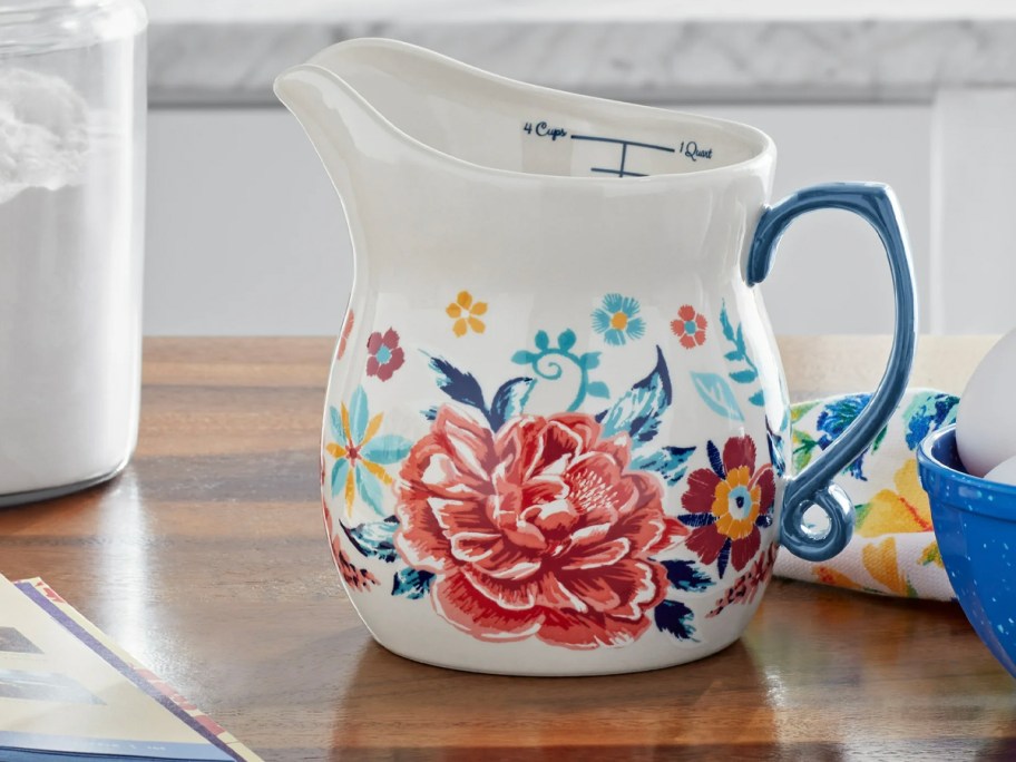 floral pitcher on table