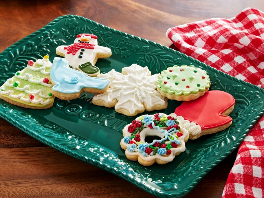 green platter filled with christmas cookies 