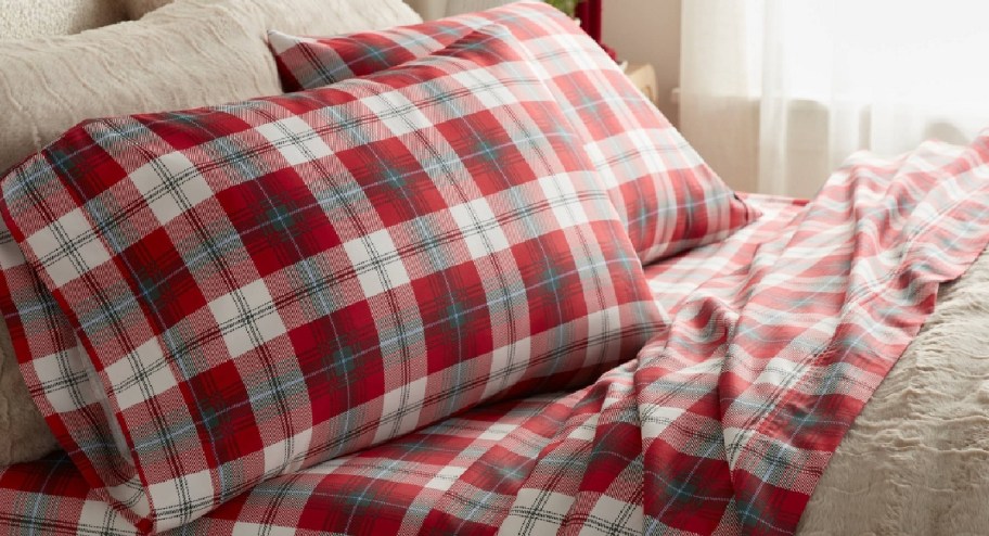 plaid bed sheets displayed with brown