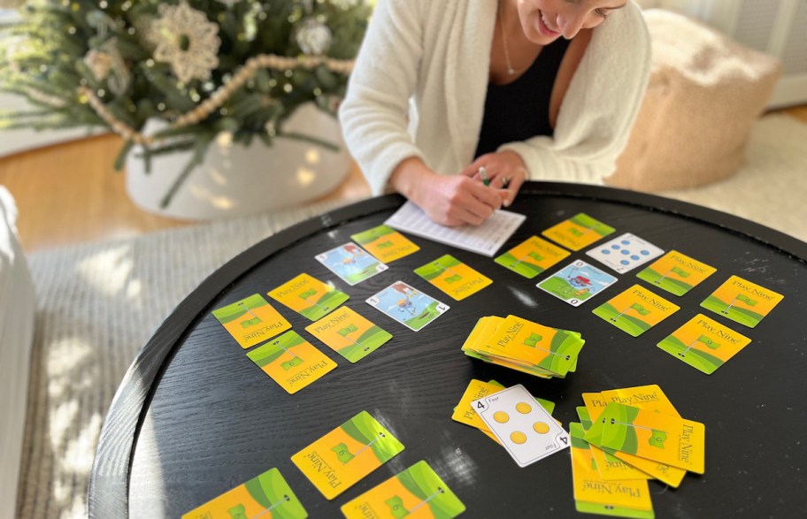 play nine card game set up on coffee table in front of christmas tree