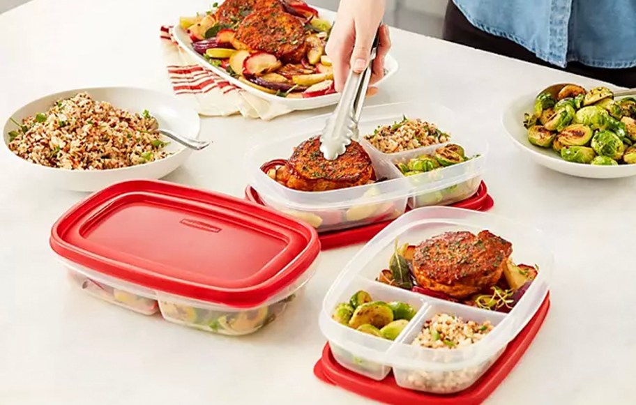 rubbermaid containers with food and red lids on table 