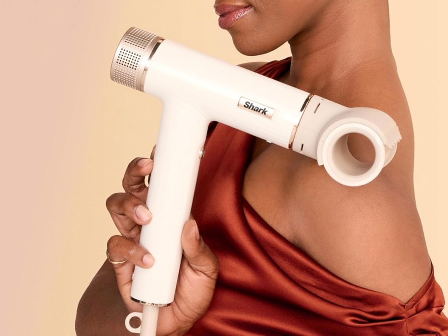 woman holding speedstyle hair dryer