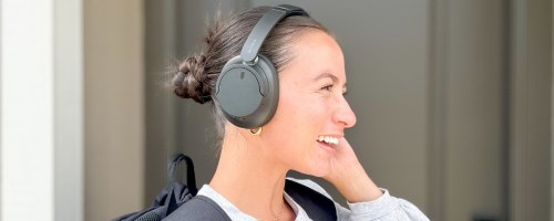 woman wearing black sony headphones