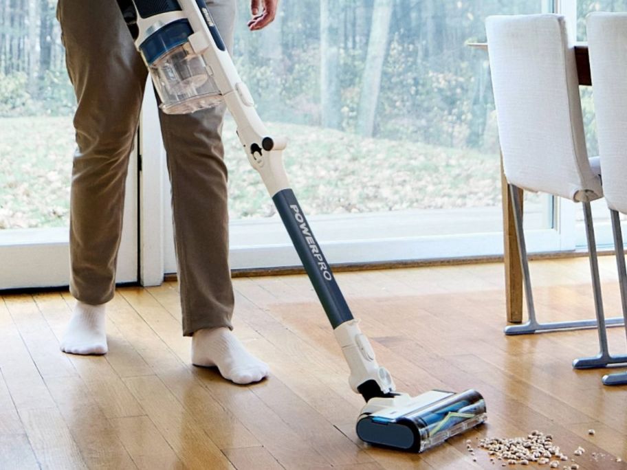 person using their shark vacuum