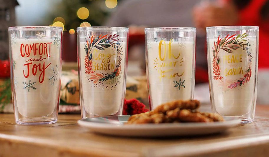 4 tervis holiday tumblers on table with cookies