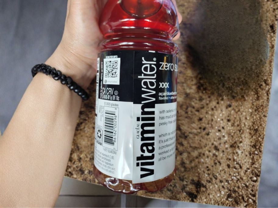 Vitaminwater Zero Sugar bottle in Acai-Blueberry-Pomegranate in hand