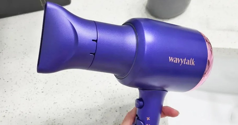 hand holding a wavytalk hair dryer