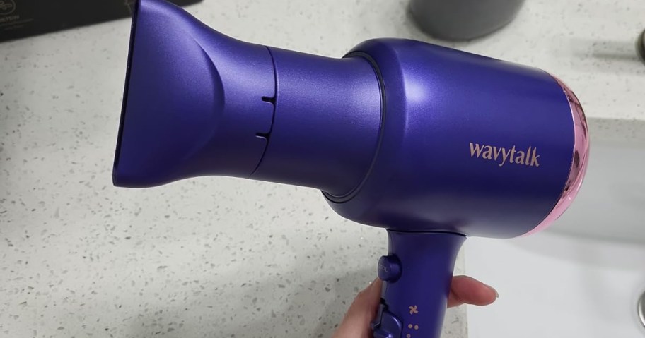 hand holding a Wavytalk Hair Dryer in white