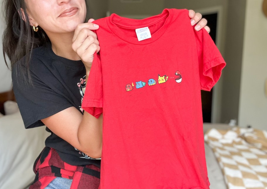 woman holding up t shirt