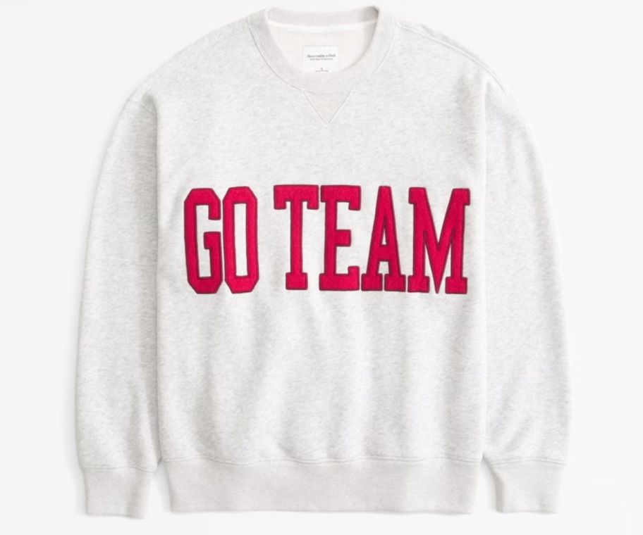 a sweatshirt with the words go team on the front. 