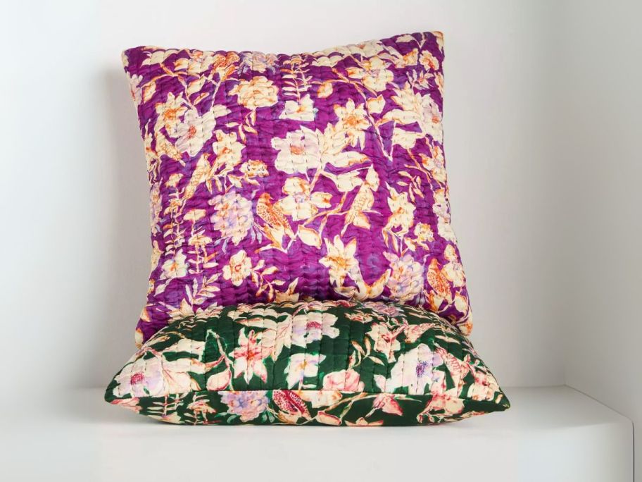 Anthropologie Delilah Silky Pillows against wall