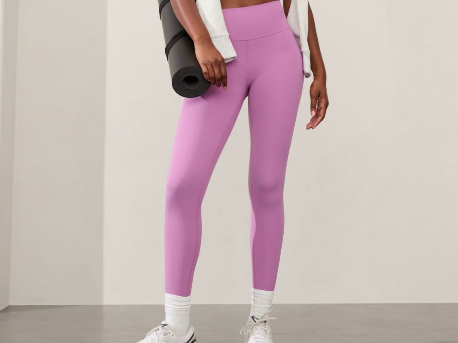 woman wearing Athleta Transcend High Rise 7/8 Legging 