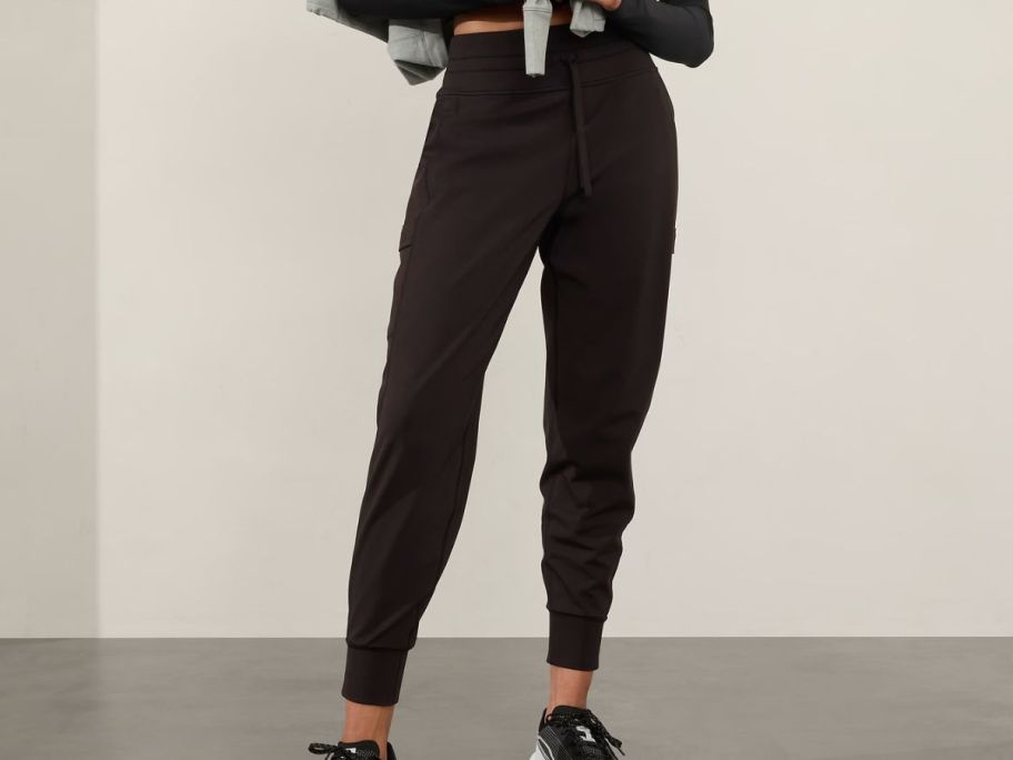 woman wearing Athleta Rainier Mid Rise Cargo Jogger