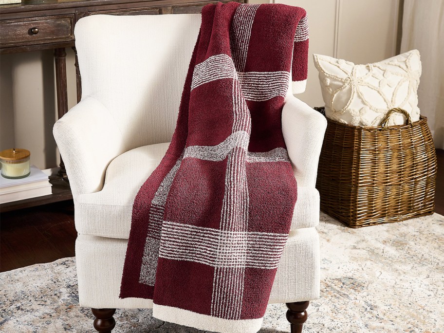 burgundy plaid throw blanket over a chair