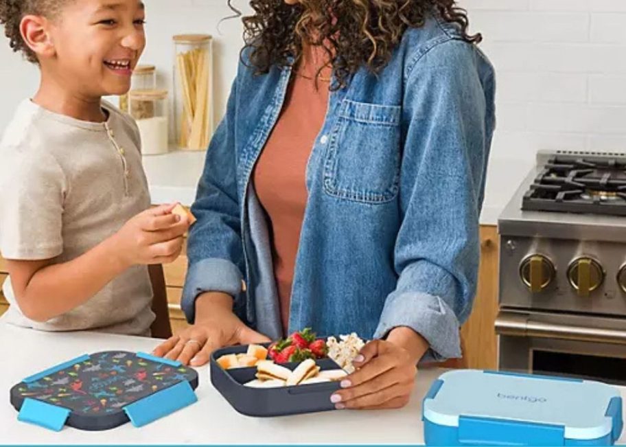 Boy and mom at the counter with Bentgo Kids Snap & Go Lunch Boxes