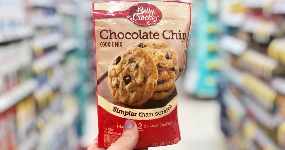 hand holding up a pouch of Betty Crocker Chocolate Chip Cookie Mix in store