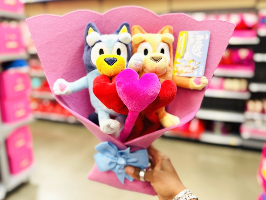 hand holding up Bluey Plush Valentine's Bouquet in store