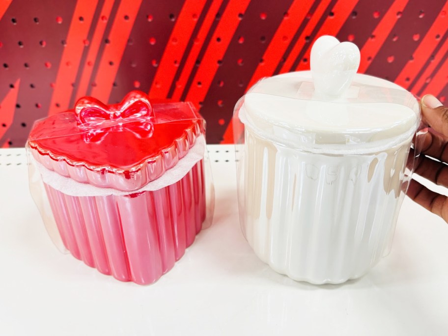 red and white ceramic vessels on store shelf