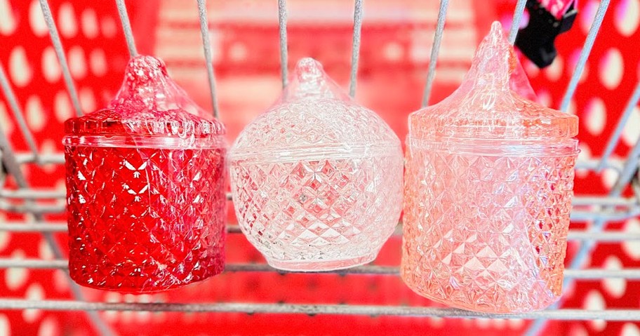 three glass jars with lids in shopping cart