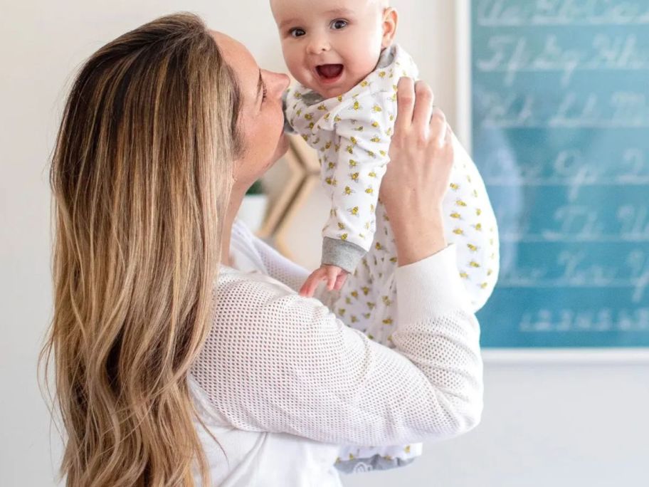 A woman and a baby. The baby is wearing Burt's Bees Honey Bee Organic Baby Footed Sleep & Play