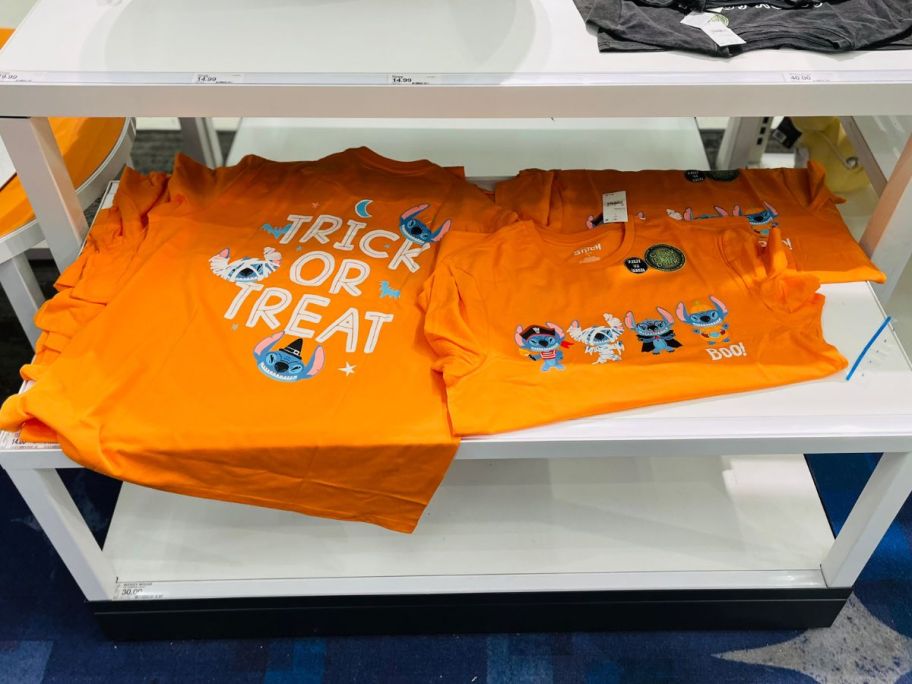 several orange trick or treat t-shirts