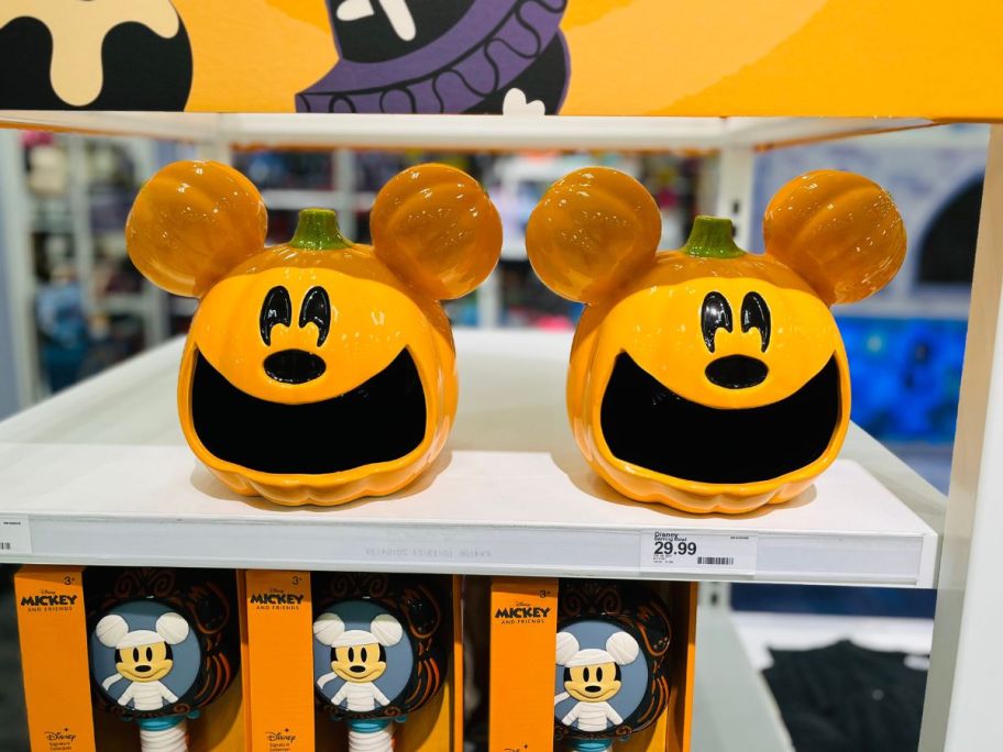 2 orange cookie jars shaped like Mickey Mouse as a pumpkin