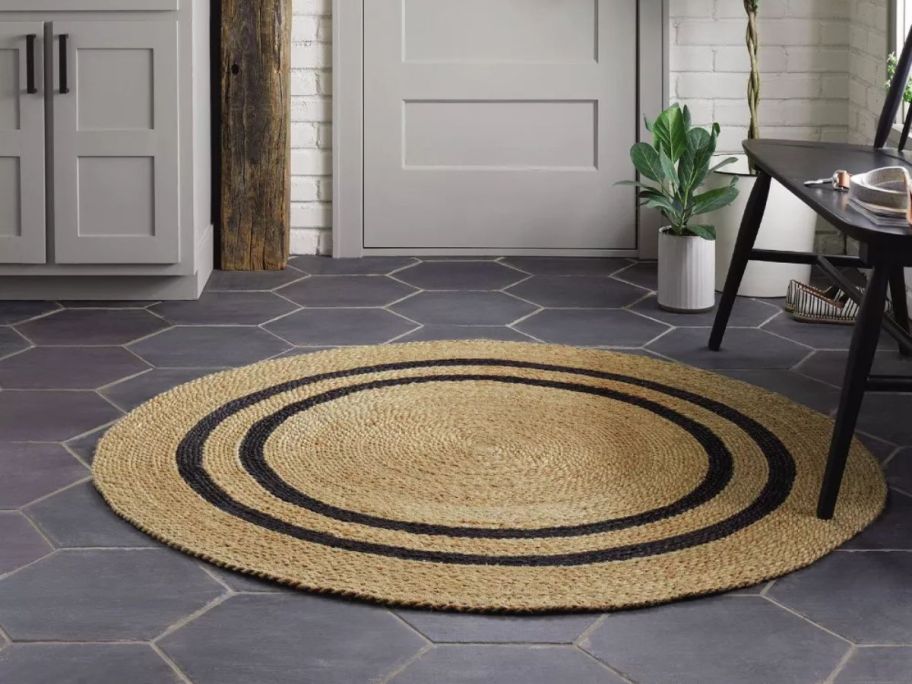 Hearth & Hand w/ Magnolia Round 5' Double Stripe Braided Jute Area Rug on floor